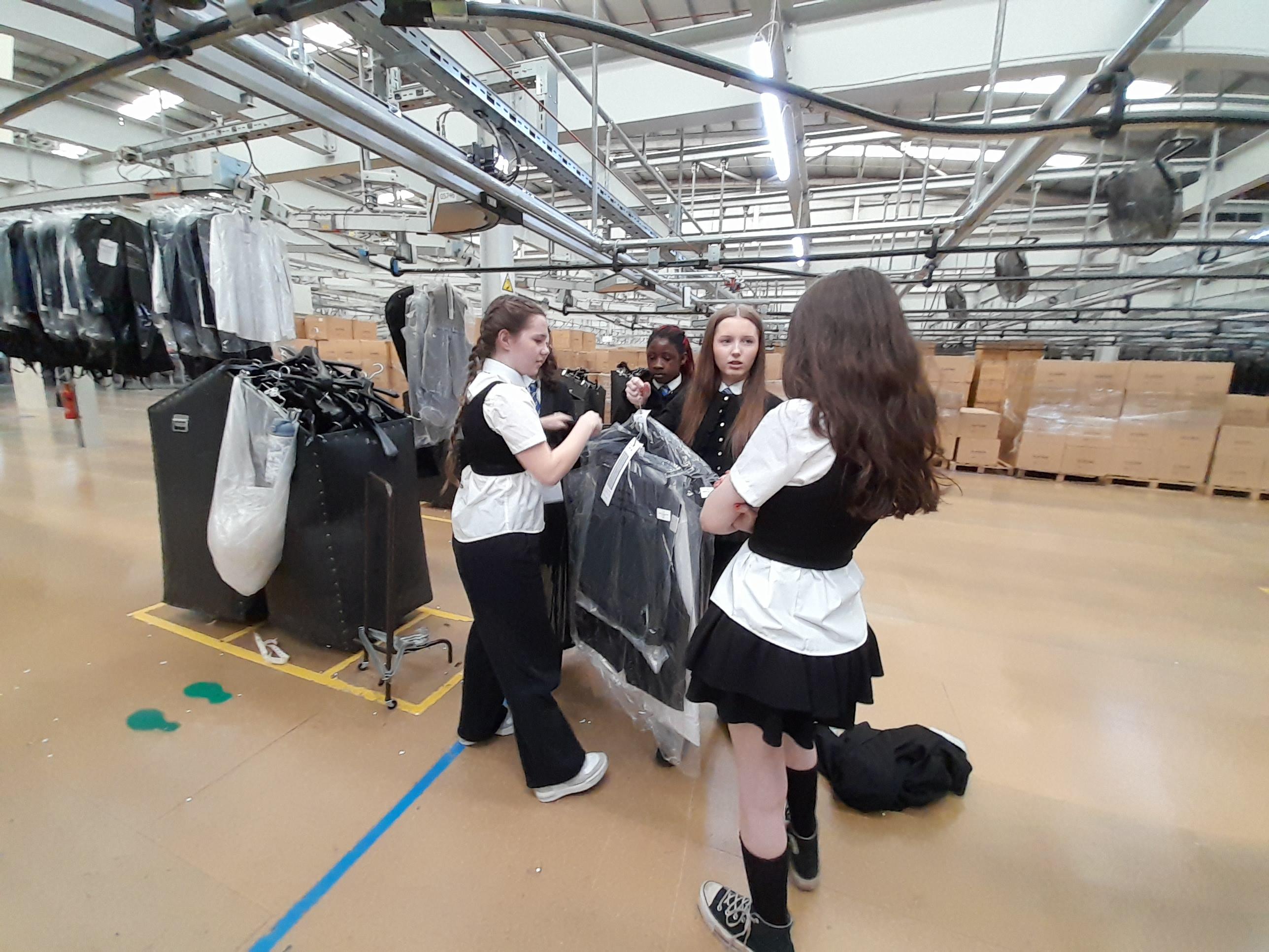 Pupils at the clothing manufacturer