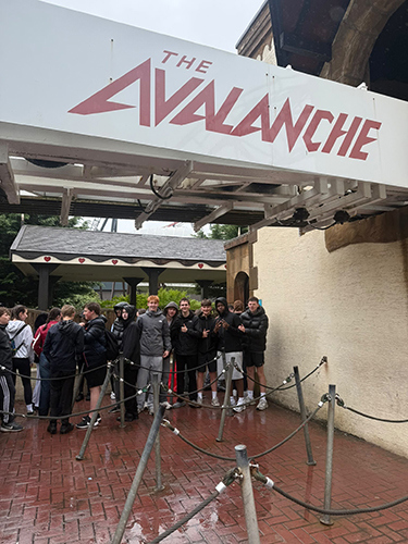 A group of children standing in front of the avalanche